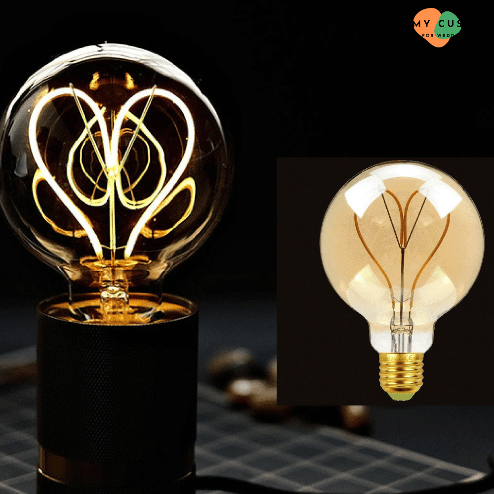 Una bombilla decorativa con un elegante filamento en forma de corazón, perfecta para crear un ambiente cálido y romántico. Un regalo original para bodas, aniversarios o decoración especial del hogar.