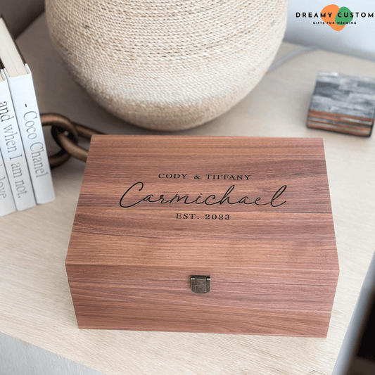 A beautifully crafted personalized wooden keepsake box, engraved with the couple's names and wedding year. A timeless and elegant gift, perfect for storing cherished memories and special mementos.