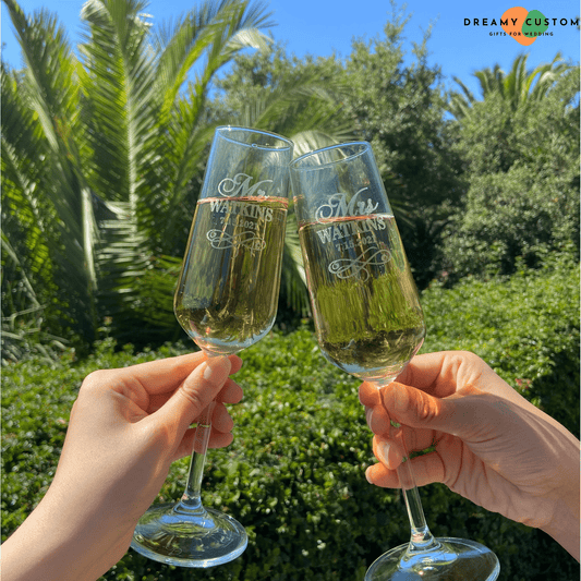 Celebrate your special day with these personalized champagne flutes, engraved with your names and wedding date. A perfect keepsake for your wedding day, adding elegance to your celebration.