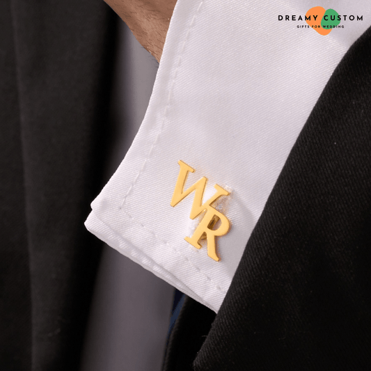 A sophisticated gold initial cufflink adds a personalized touch to a crisp white cuff, perfect for weddings and formal occasions. A timeless accessory for grooms, groomsmen, and stylish gentlemen.