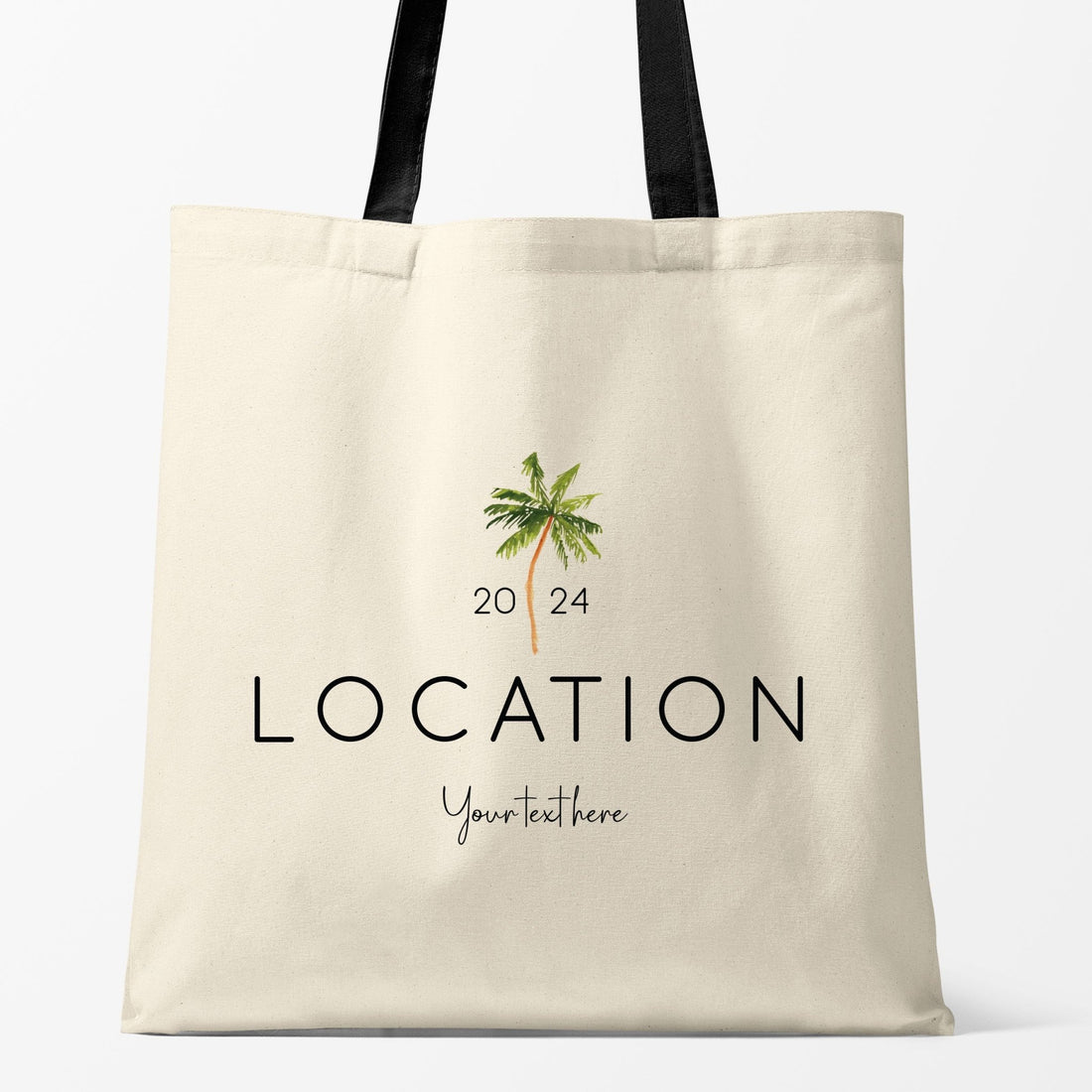 The image displays a customizable beach tote bag with a palm tree design. The text "LOCATION 2024" is featured prominently, with a space for personalized text, making it ideal for destination weddings or events.