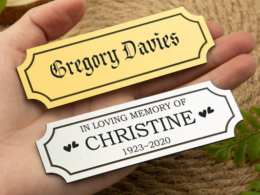 Custom engraved brass plates for memorials with names like "Gregory Davies" and "In Loving Memory of Christine."