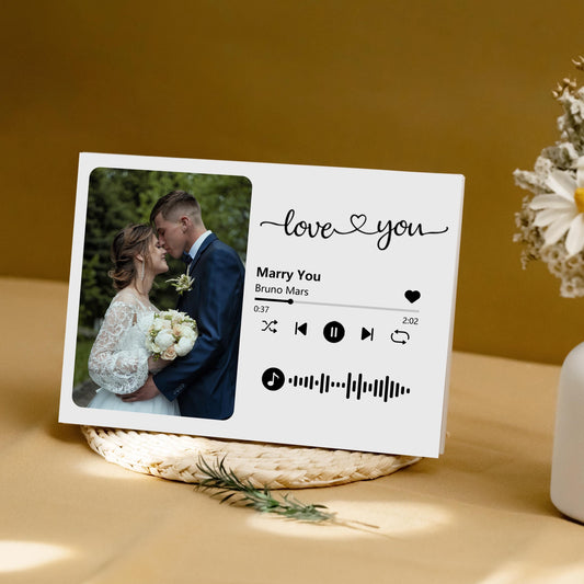 Personalized wedding video book with photo frame displaying a bride and groom's wedding moment.