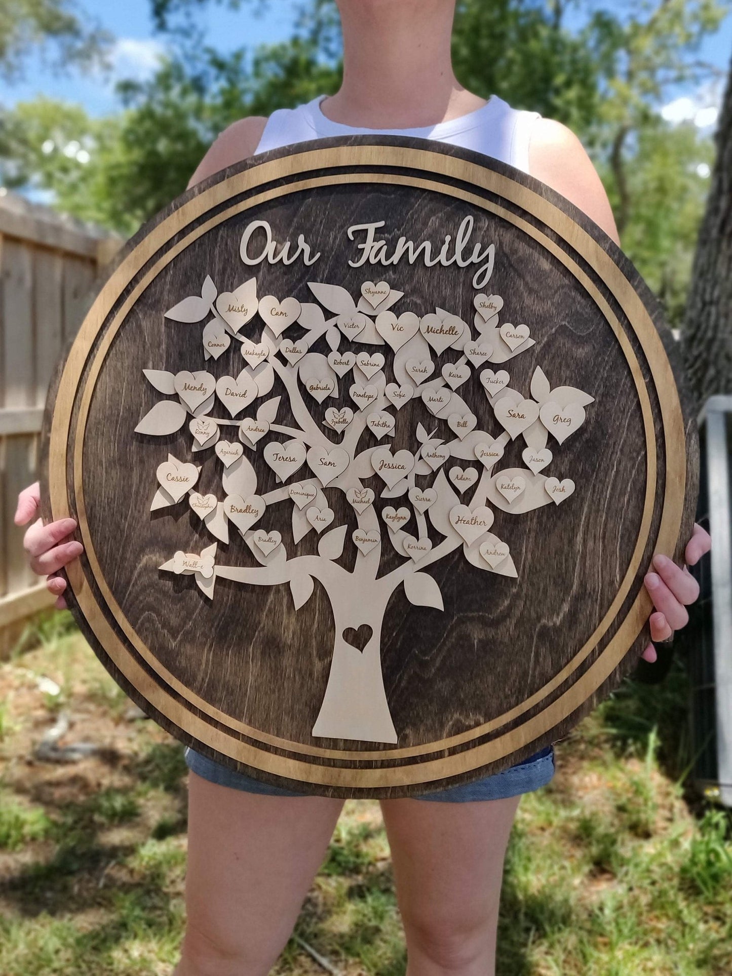 Large personalized wooden family tree with detailed engraved leaves, hearts, and pet shapes, ideal for thoughtful home gifting and decoration.