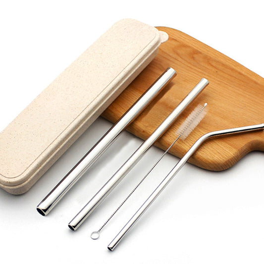 Custom eco-friendly metal straw set with a cleaning brush and case on a wooden board