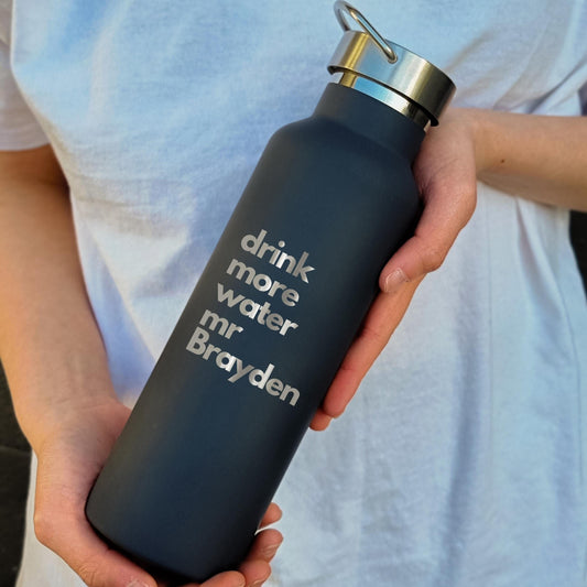 Personalized stainless steel water bottle engraved with the message "drink more water mr Brayden," perfect for custom hydration gifts.