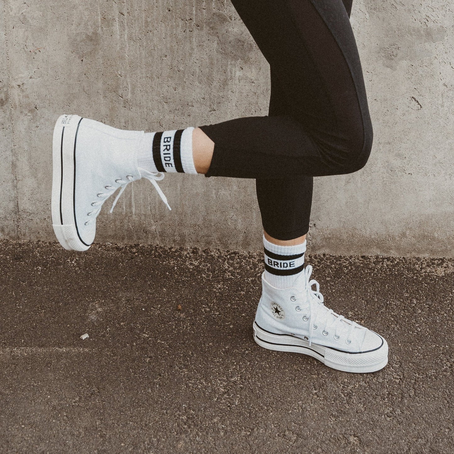 White bride socks styled with high-top sneakers.