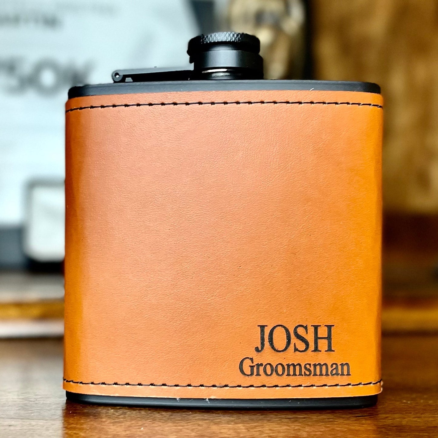 Orange leather flask with 'Josh Groomsman' engraving