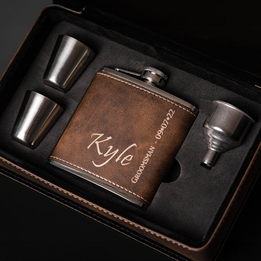Personalized flask set for groomsmen with custom name "Kyle" engraved on leather cover