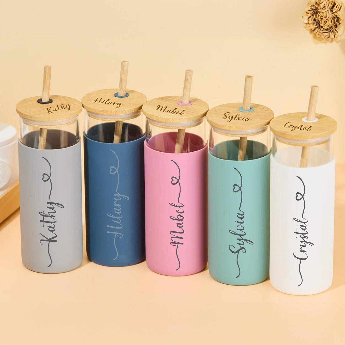 Set of five personalized tumbler glasses in various colors.