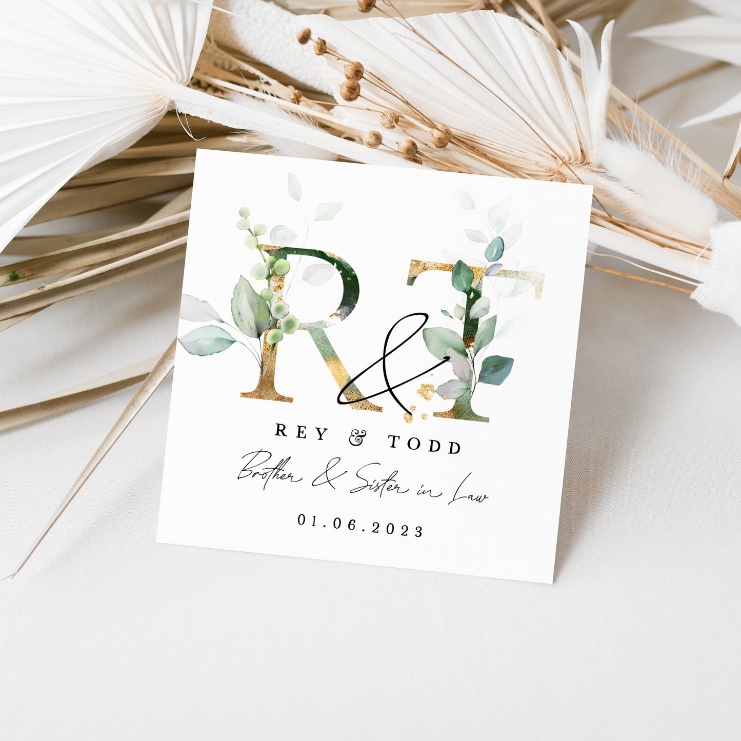 Personalized wedding thank you card for Rey & Todd with watercolour floral design, featuring their initials and wedding date.