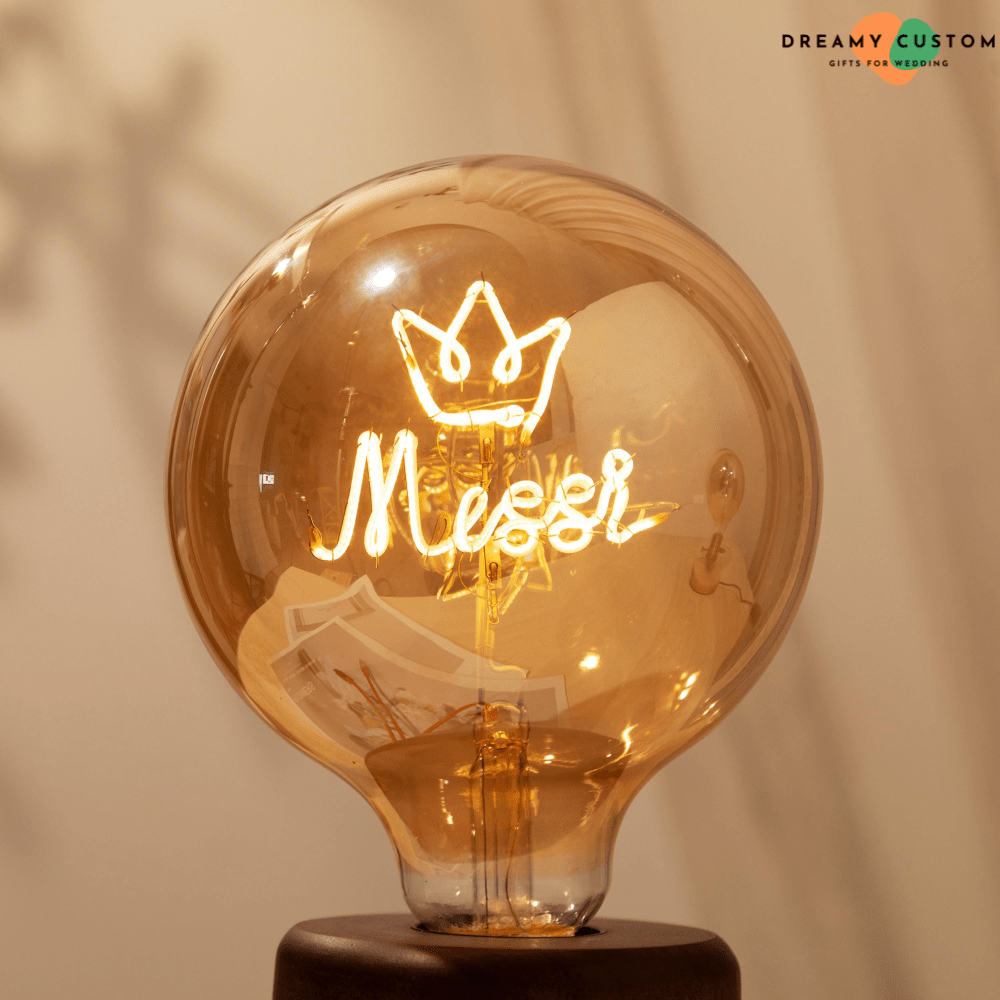 A unique personalized filament light bulb featuring a glowing custom design with a crown and name. A stylish and meaningful decorative piece, perfect for gifts, weddings, or special occasions.