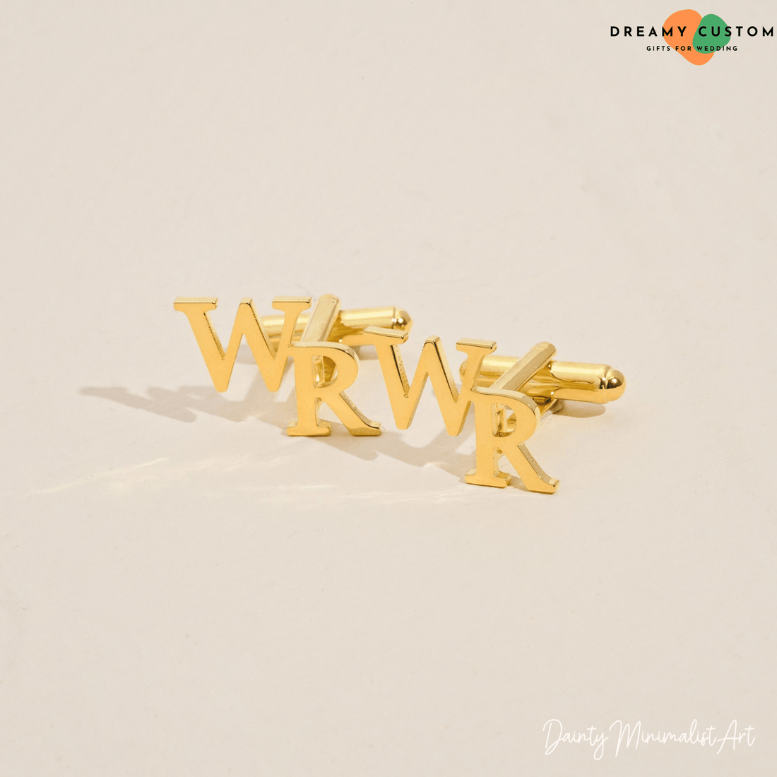 Customized gold initial cufflinks for men, perfect for weddings and special occasions.