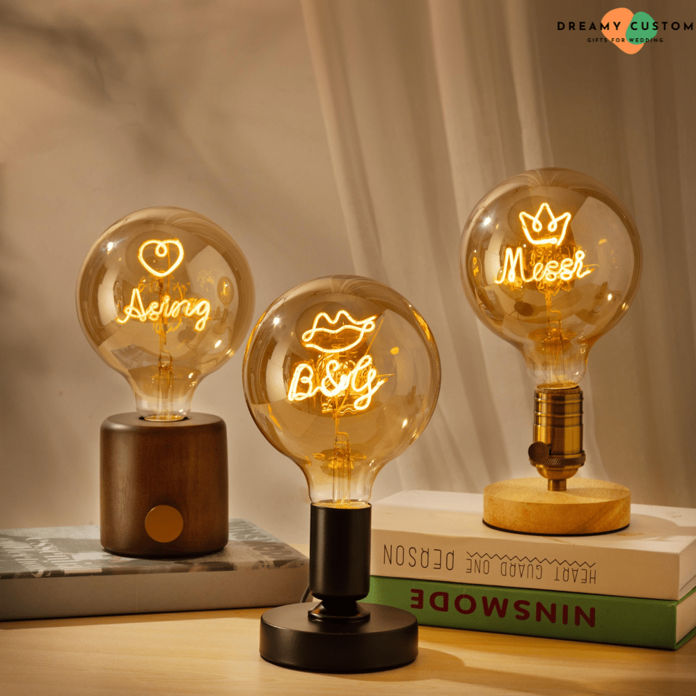 Elegant personalized filament light bulbs with glowing custom designs, perfect for anniversaries, weddings, or home décor. A unique and meaningful gift that brings warmth and personalization to any space.