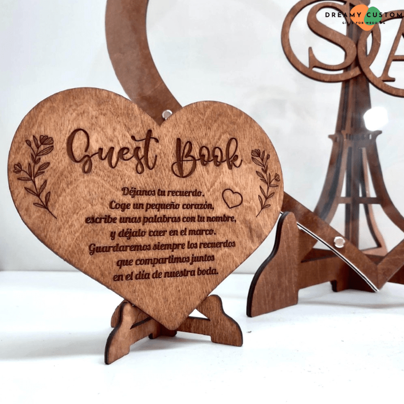 Beautifully designed wooden wedding guest book sign, inviting guests to leave their names and messages on wooden hearts for a lasting memory of the special day.