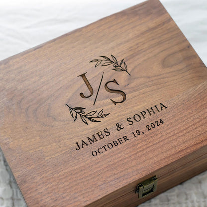 Side-by-side comparison showing two sizes of custom walnut keepsake boxes, both elegantly crafted with metal clasps.