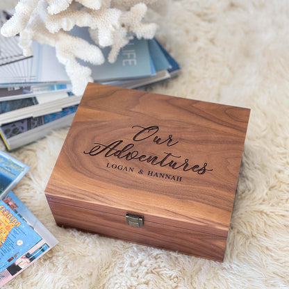 Personalized engraved walnut memory box featuring elegant script engraving "Our Adventures" with couple's names Logan & Hannah