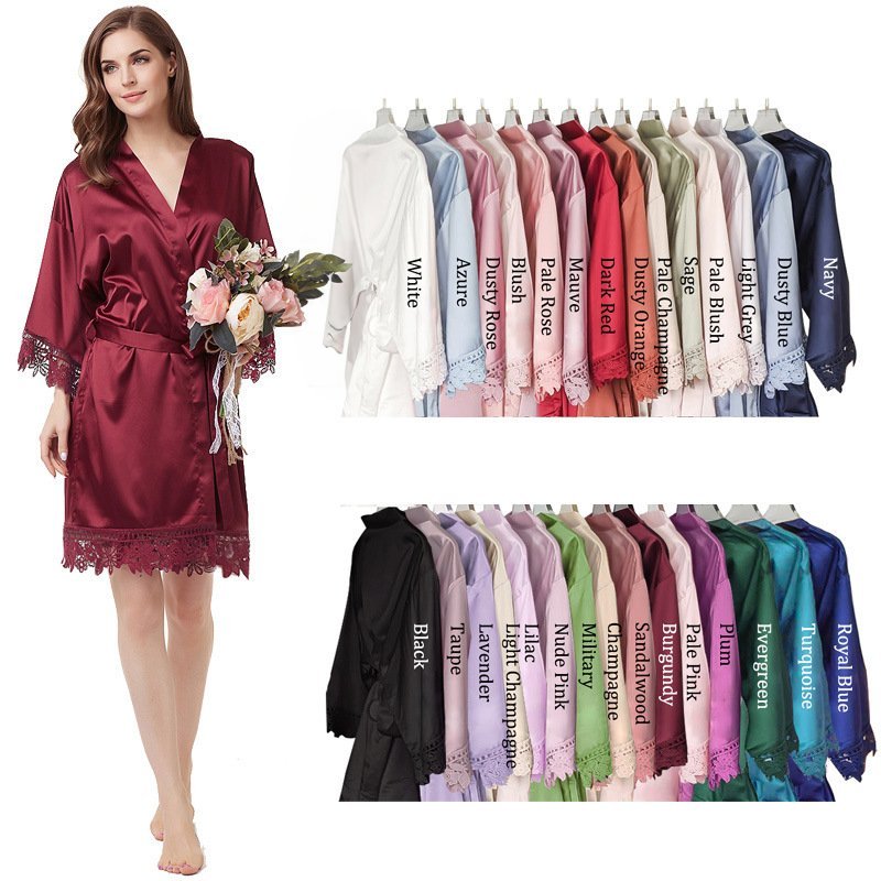 Variety of bridesmaid robe colors: A display of satin bridesmaid robes in multiple colors including sage, navy, and dusty rose, showing options for customization.