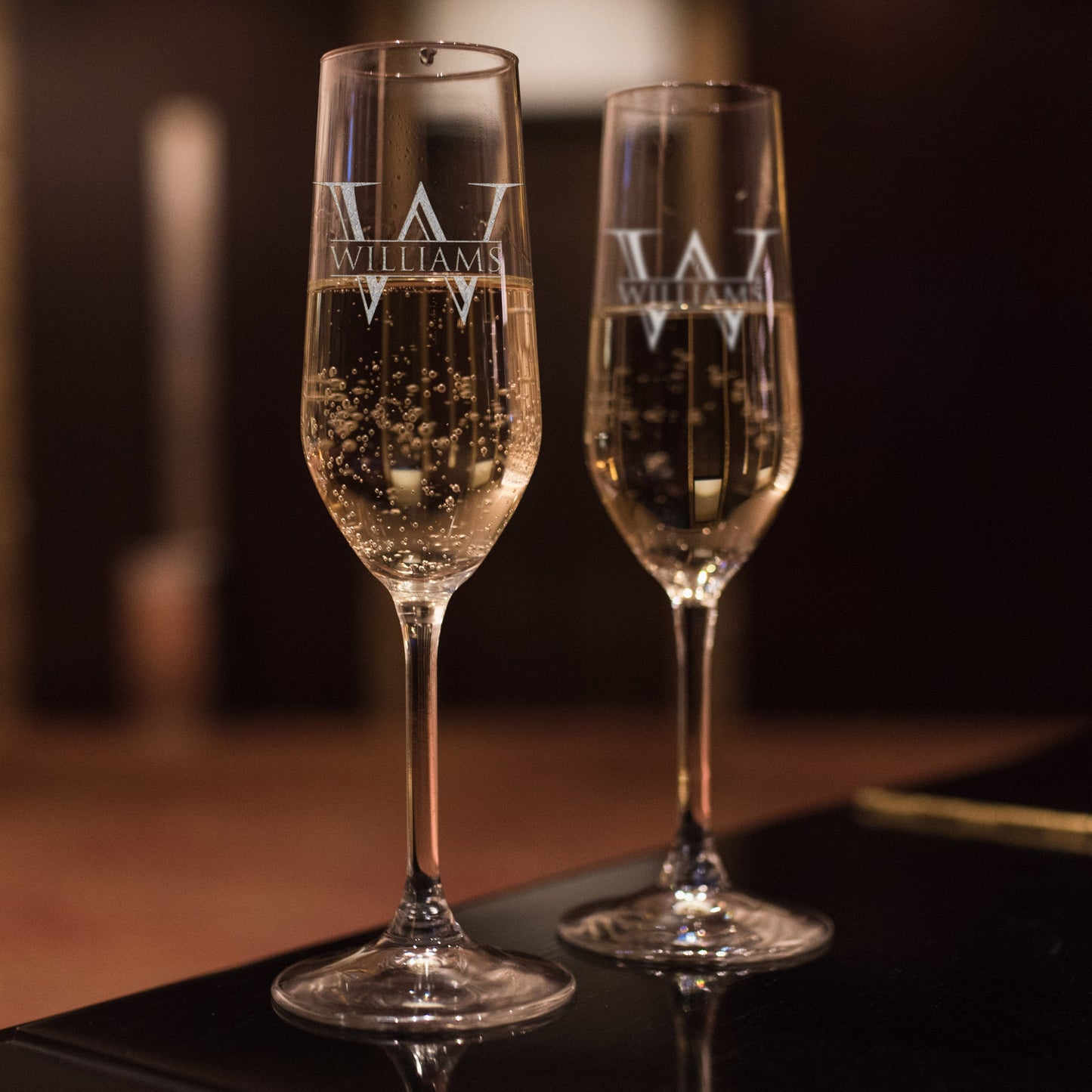 Custom engraved wedding champagne flutes with monogram design