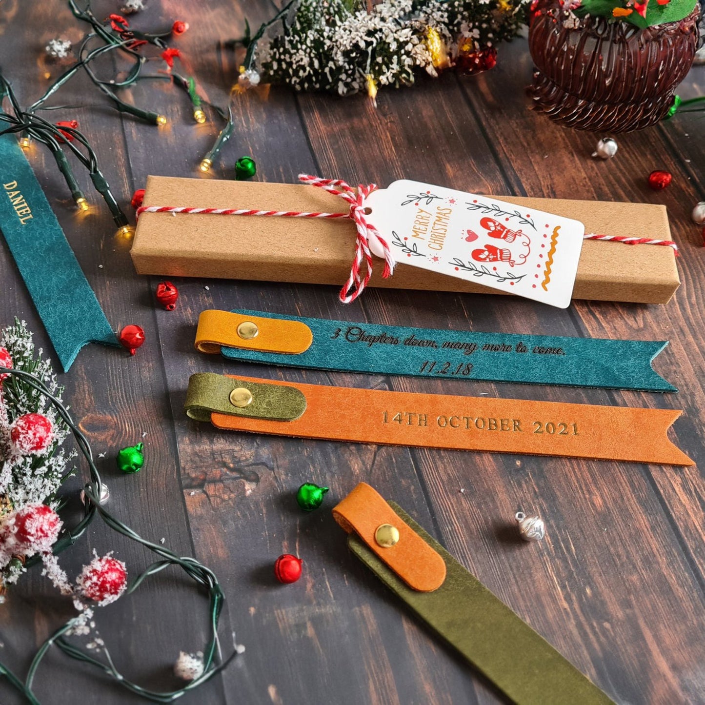 Collection of colorful leather bookmarks with personalized text and decorative stitching.