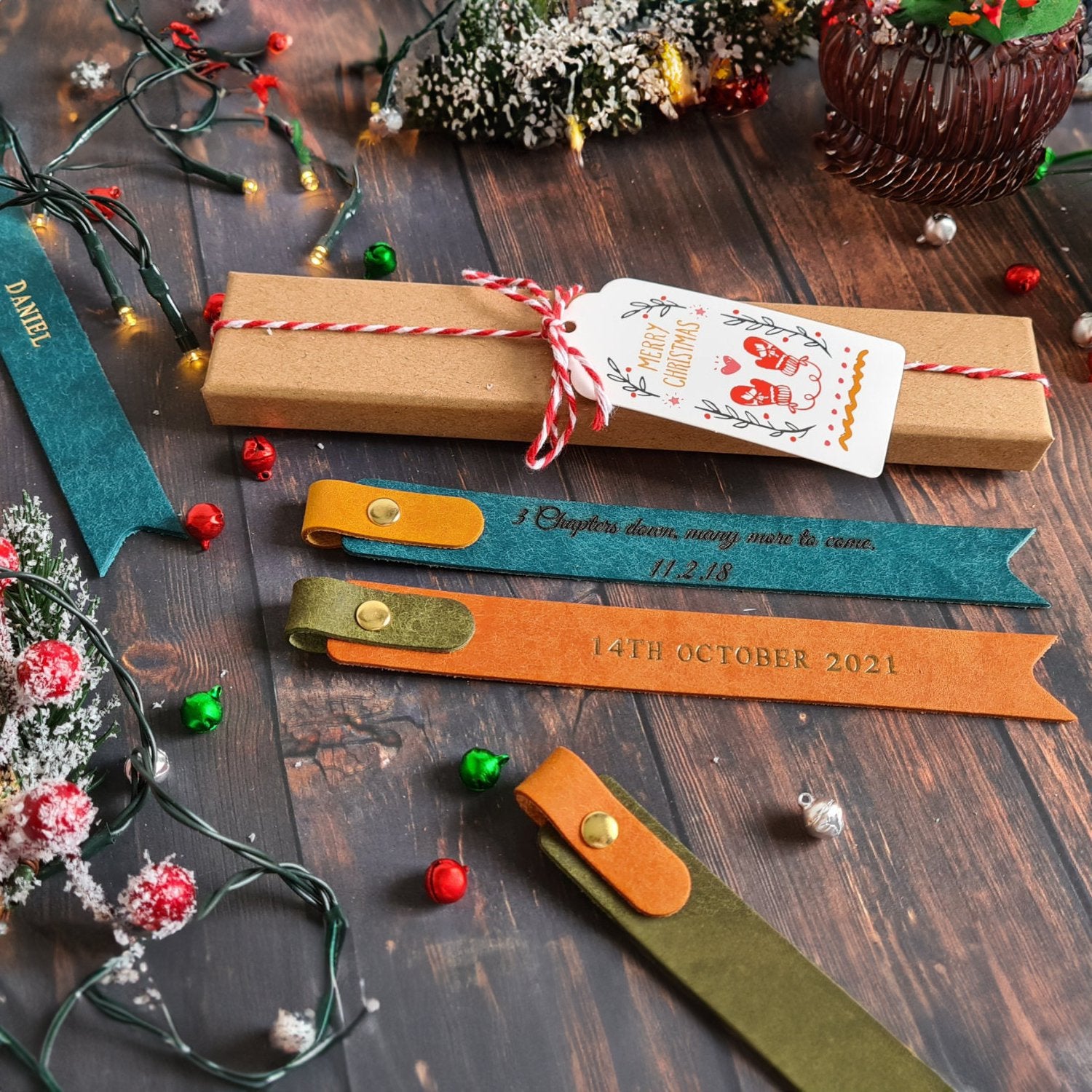 Collection of colorful leather bookmarks with personalized text and decorative stitching.