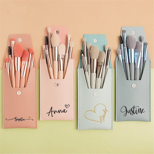 Set of custom makeup bags in pastel colors with personalized names on each bag.