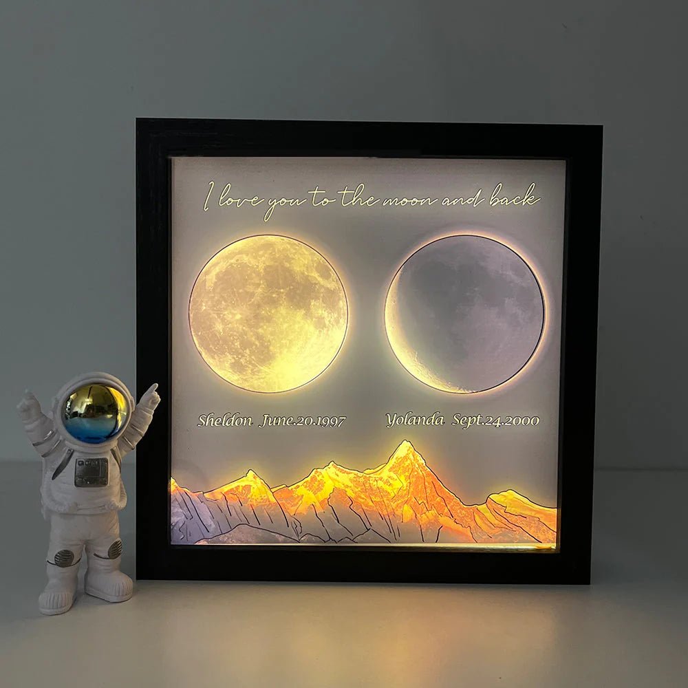 Space-themed decor with a custom moon phase frame and astronaut figurine.