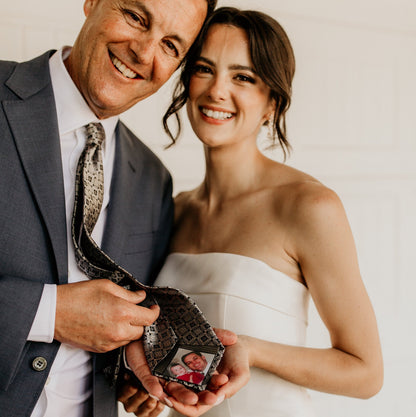 Custom Photo Tie Patch: The daddy and daughter smiles, revealing a tie patch with a photo.