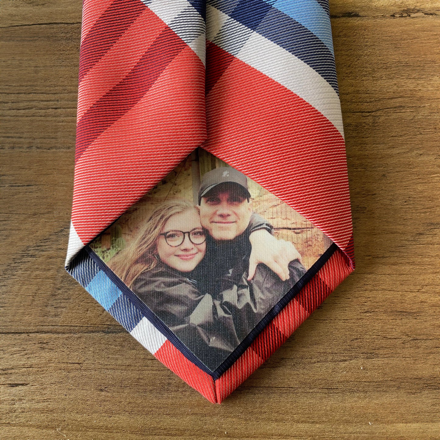 Custom Photo Tie Patch: A red and blue striped tie featuring a couple's photo.