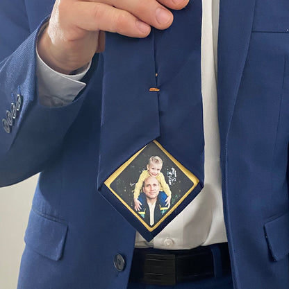 Custom Photo Tie Patch: A blue suit and tie with a family photo patch.