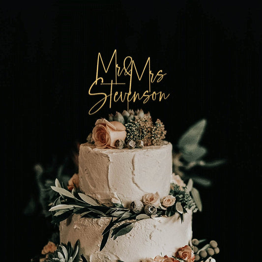 Elegant gold cake topper for wedding cakes.
